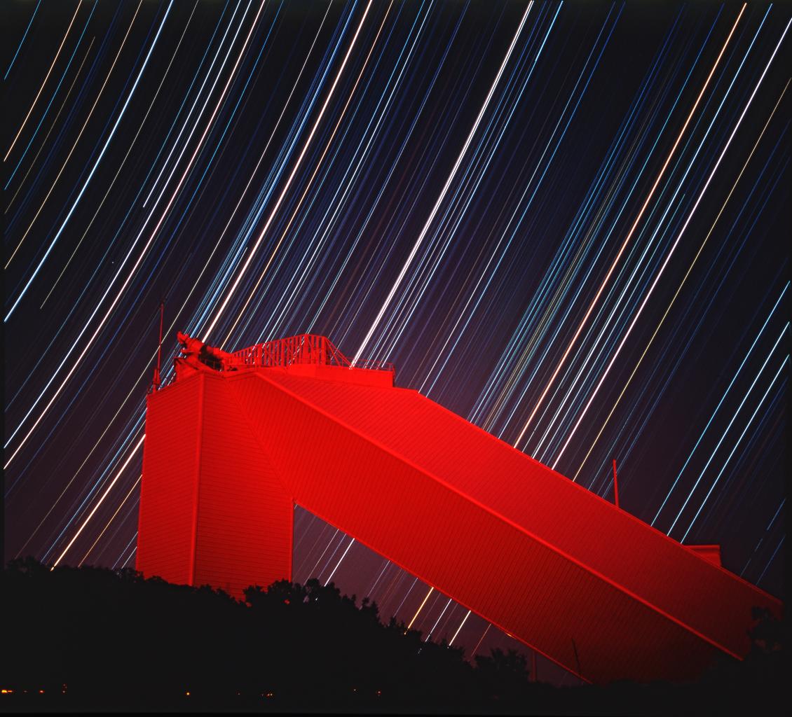 McMath Pierce Solar telescope at night with star trails