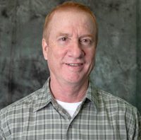 head shot of Bob Blum against a grey background