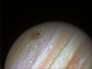 Photo of Jupiter with a red scar from the comet collision