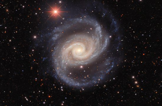 This image, taken by astronomers using the US Department of Energy-fabricated Dark Energy Camera on the Víctor M. Blanco 4-meter Telescope at Cerro Tololo Inter-American Observatory, a Program of NSF’s NOIRLab, captures the galaxy NGC 1566 as it twirls, flinging its arms through the vastness of space. Colloquially nicknamed the Spanish Dancer, this spiral galaxy is often studied by astronomers learning about galaxy groups, stars of different ages, and galactic black holes.