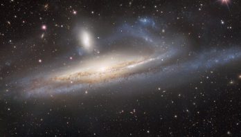 NOIRLab: Dark Energy Camera Captures Galaxies in Lopsided Tug of War, a Prelude to Merger