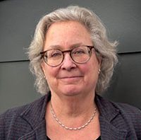 Headshot of a woman with glasses
