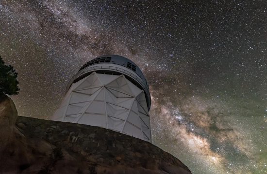 The sparkling band of the Milky Way Galaxy backdrops the Nicholas U. Mayall 4-meter Telescope, located at Kitt Peak National Observatory (KPNO) near Tucson, Arizona.