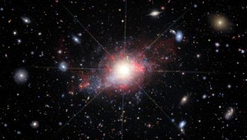 Artist’s illustration of dwarf galaxy with active galactic nucleus
