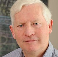 Head shot of man with white hair