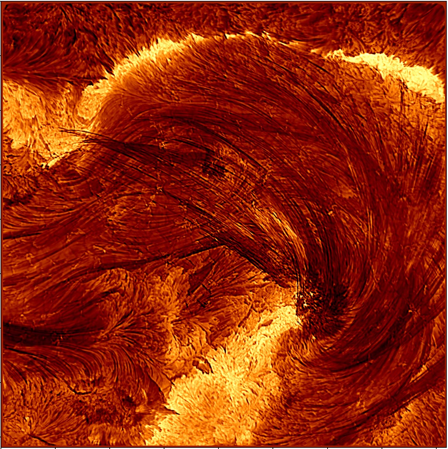A close up image of the Sun with an orange wave-like structure in th middle and bright yellow sections above and below ir. It is covered in dark lines indicating the direction of the wave.