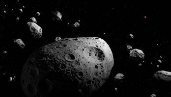 This artist’s illustration depicts 2025 MN45 — the fastest-rotating asteroid with a diameter over 500 meters that scientists have ever found. The asteroid is shown surrounded by many other asteroids, depicting its location within the main asteroid belt. The Sun and Jupiter are shown in the distance. 2025 MN45 is 710 meters (0.44 miles) in diameter, and it completes a full rotation every 1.88 minutes. The discovery was made using data from NSF–DOE Vera C. Rubin Observatory, jointly funded by the U.S. National Science Foundation and the U.S. Department of Energy's Office of Science.