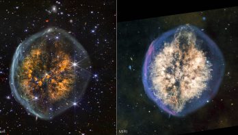 Side-by-side images of the same nebula show how differently it appears in near-infrared, on the left, versus mid-infrared light, on the right. Left image is labeled NIRCam and the right is labeled MIRI. In near-infrared, the nebula’s outer bubble has a white edge and its inner clouds are orange, with a distinct dark lane cutting vertically through the center. Stars and background galaxies appear around the nebula and through the outer bubble. In mid-infrared, the outer bubble has a bluish tint and there is more material in the inner clouds, which are colored off-white. The vertical dark lane is still present but more interrupted and covered by the clouds. Material appears to be erupting out the top of the nebula, and this effect is mirrored to a lesser degree at the bottom, opposite end.