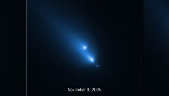 A time sequence of three panels side by side. From left to right, the panels are labeled November 8, 2025; November 9, 2025; and November 10, 2025. This series of images from NASA’s Hubble Space Telescope of the fragmenting comet C/2025 K1 (ATLAS), or K1 for short, was taken over the course of three consecutive days. The sequence shows the progressive disintegration of the comet over this brief period. Each panel features several bright, fuzzy, blue, streaking lights in a diagonal line from the upper left to the lower right of a black background. In the first panel, four comet-like objects appear. The largest is the second from the upper left. In the second panel, the largest object has broken into two pieces. In the third panel, the pieces appear to be moving away from each other along the invisible diagonal line.